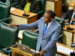 Clarke hits back at debt repayment criticism